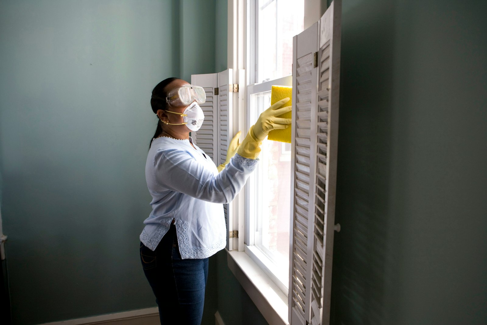 Professional cleaner wiping a kitchen surface